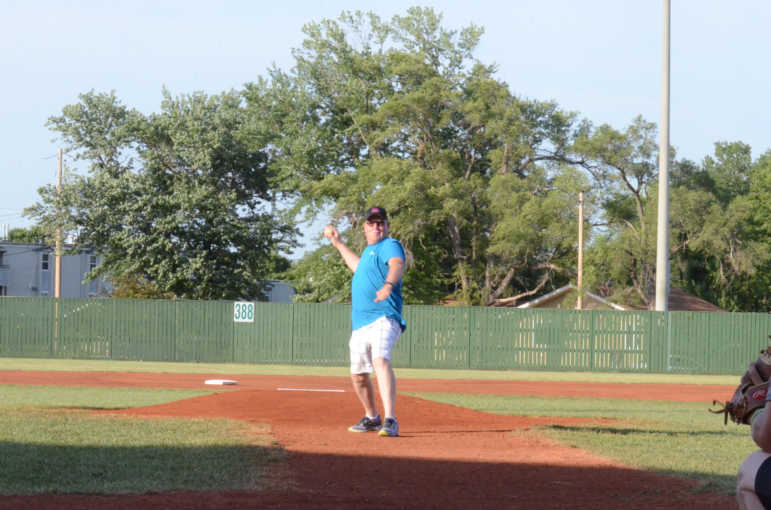 Photo Courtesy of The Daily Union - Mark Ediger, Eagle Communications, throws out the first pitch at United Way Night at the JC Brigade 6-9-18